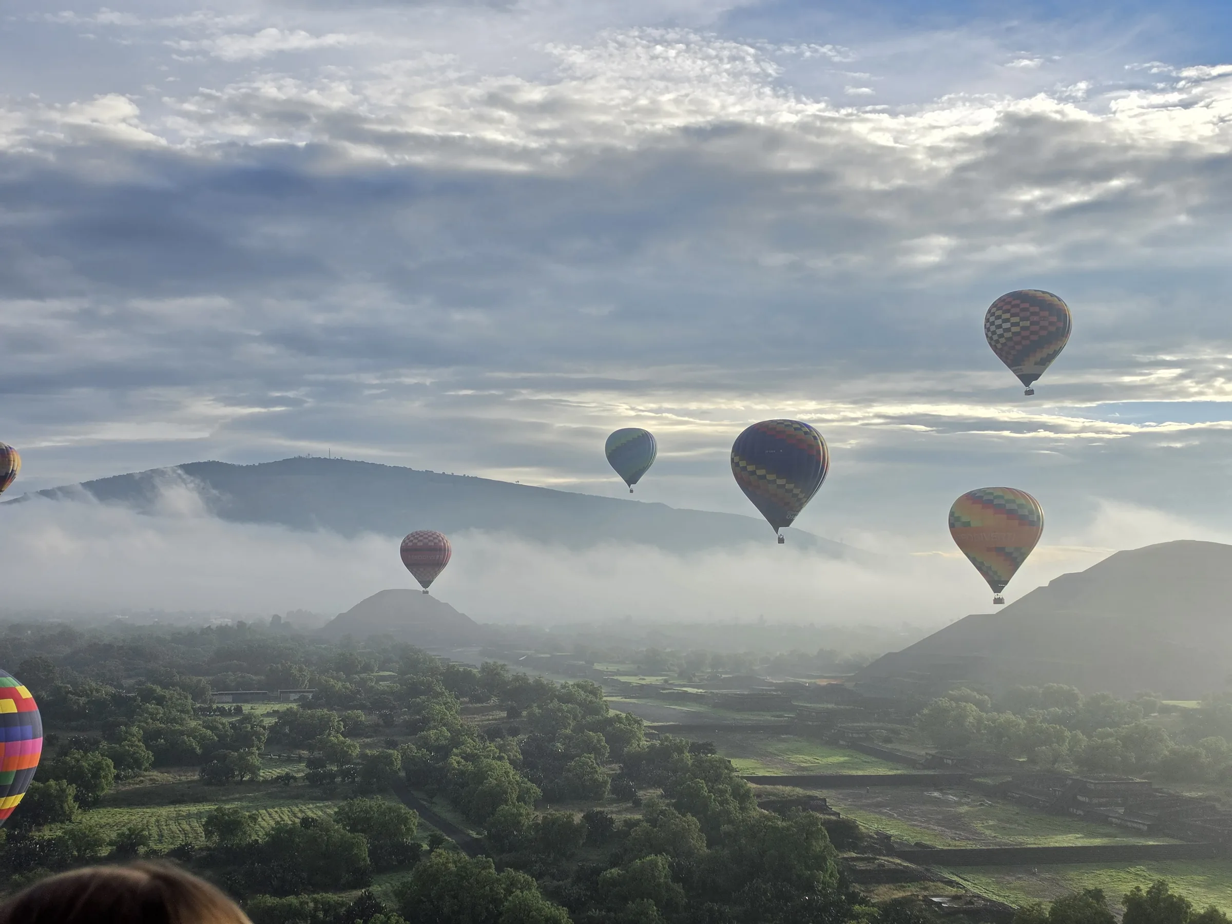 Balloons above cloud cover at Teotihuacán